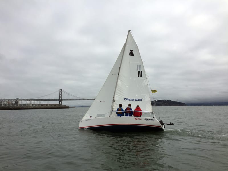 An Andrews 21 heading toward the camera, the Bay Bridge in the distance