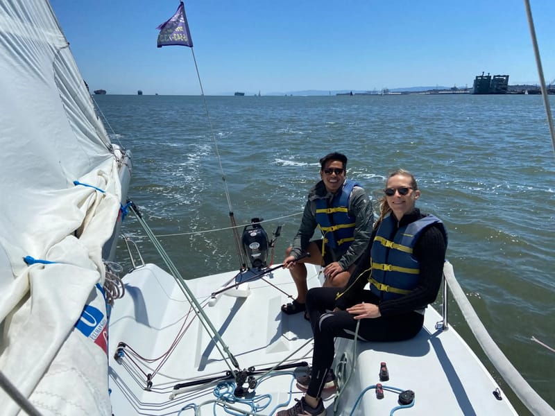 Two sailors aboard an Andrews 21 on a sunny afternoon