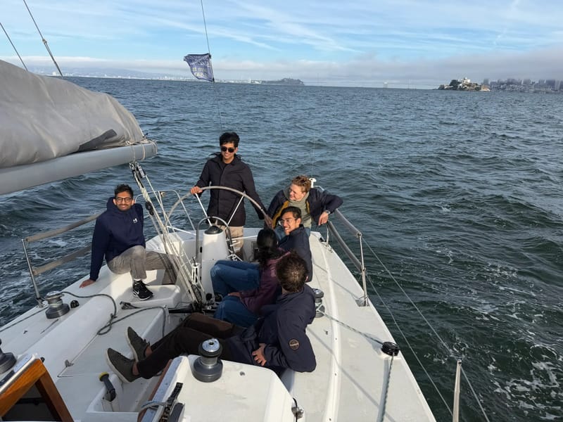 Sailors aboard a J/105 heading across the Bay