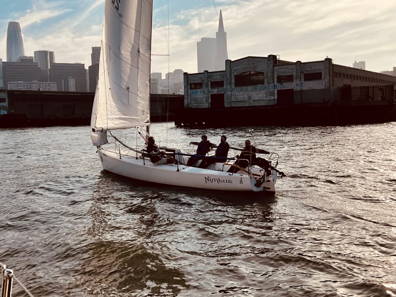 The J/80 Nimbus sailing along the city waterfront