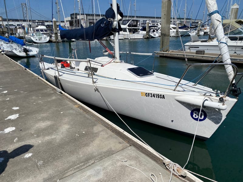 A J/80 tied up at the dock in South Beach Harbor