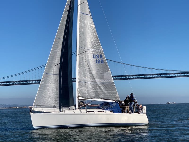 The J/109 Cirrus sailing on San Francisco Bay beneath the Bay Bridge